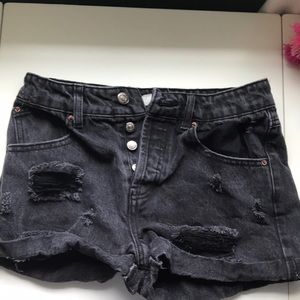 Black distressed jean shorts.
